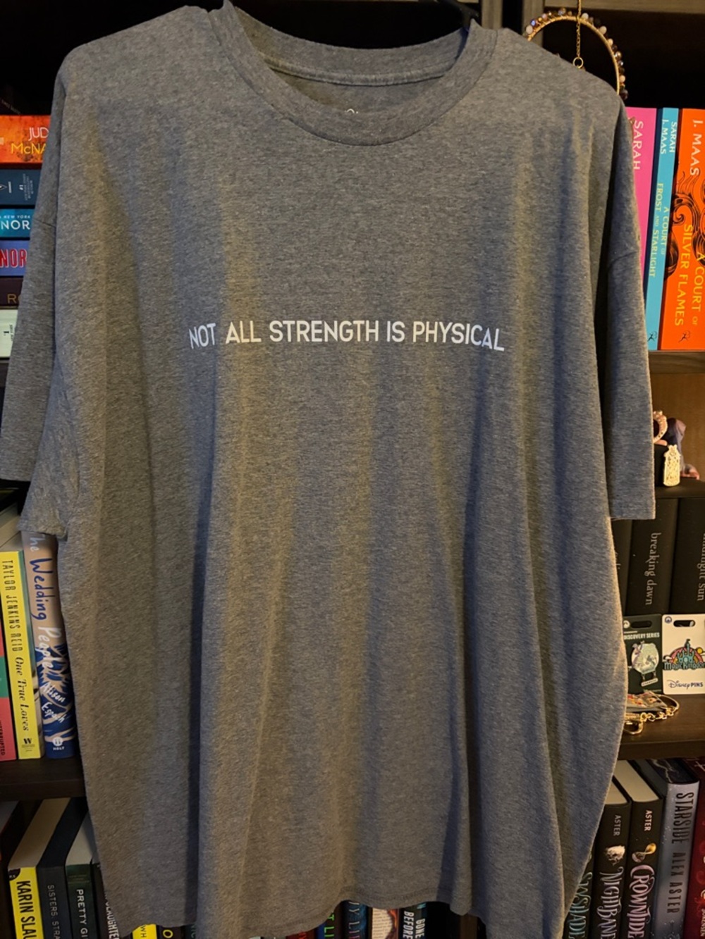 Grey Short-Sleeve Tee with 'Not All Strength Is Physical' Text